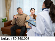 Father and daughter pregnant woman visit gynecologist doctor at medical clinic for pregnancy consultant. Doctor examine pregnant belly for baby and mother healthcare check up. Стоковое фото, агентство Ingram Publishing / Фотобанк Лори