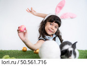 Easter bunny fun with little children the beauty of friendship between humans and animals. Стоковое фото, агентство Ingram Publishing / Фотобанк Лори