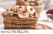 Healthy breakfast table,  homemade pancakes with banana, goji and walnuts. Стоковое фото, агентство Ingram Publishing / Фотобанк Лори