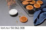 Caramel cookies flowing out of the oven, in the kitchen after baking. Стоковое фото, агентство Ingram Publishing / Фотобанк Лори