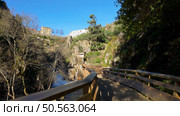 Hiker’s point of view along the Corgo river walkways in Vila Real, Portugal. Стоковое фото, агентство Ingram Publishing / Фотобанк Лори