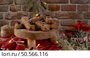 Cereal bars with almonds, coconut and cranberries on a Christmas season table decorated with lights. Стоковое фото, агентство Ingram Publishing / Фотобанк Лори