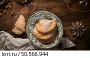 A crescent-shaped pastry whose filling is made of eggs and almonds wrapped in crispy dough, cut in an artisanal way and sprinkled with sugar. Стоковое фото, агентство Ingram Publishing / Фотобанк Лори
