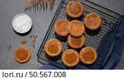 Caramel cookies flowing out of the oven, in the kitchen after baking. Стоковое фото, агентство Ingram Publishing / Фотобанк Лори
