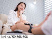 Customer’s feet after cleaning before the manicurist used cutting tools polish and paints customer’s toenails. Стоковое фото, агентство Ingram Publishing / Фотобанк Лори