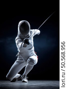 A man in a white outfit is holding a sword and is crouching down. Стоковое AI-изображение, AI-художник Ярославский Максим / Фотобанк Лори