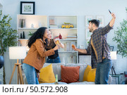 Multiethnic friends had fun party and drinking wine at home. Стоковое фото, агентство Ingram Publishing / Фотобанк Лори