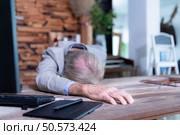 An elderly businessman suffered a sudden heart failure at work. Стоковое фото, агентство Ingram Publishing / Фотобанк Лори