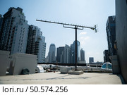 An old television signal antenna in the middle of the city. that still have some to receive signals. Стоковое фото, агентство Ingram Publishing / Фотобанк Лори