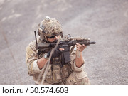 Soldiers in camouflage military uniforms carrying weapons, Reconnaissance missions in rugged mountains, Assault infantry battle training. Стоковое фото, агентство Ingram Publishing / Фотобанк Лори