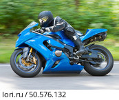 Dynamic and realistic motorbike racing. Стоковое фото, агентство Ingram Publishing / Фотобанк Лори