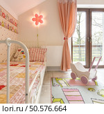 Modern spacious room for a girl with bright colourful details. Стоковое фото, агентство Ingram Publishing / Фотобанк Лори
