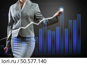 Hand of businesswoman drawing virtual infographs on media screen. Innovative technologies for your business . Mixed media. Стоковое фото, агентство Ingram Publishing / Фотобанк Лори
