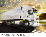 White truck on the road with the landscape at sunset. Truck transport. Стоковое фото, агентство Ingram Publishing / Фотобанк Лори