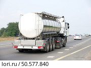 Container on the big highway. transport loads. Стоковое фото, агентство Ingram Publishing / Фотобанк Лори