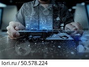 businessman hand working with modern technology digital tablet computer and digital layer effect as business strategy concept. Стоковое фото, агентство Ingram Publishing / Фотобанк Лори