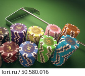Colorful chips on a green table. Concept of casino and gambling. Clipping path on the chips. Стоковое фото, агентство Ingram Publishing / Фотобанк Лори