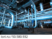 Pipes, tubes, machinery and steam turbine at a power plant                . Стоковое фото, агентство Ingram Publishing / Фотобанк Лори