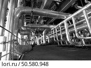 Pipes, tubes, valves, cables at a power plant b&w               . Стоковое фото, агентство Ingram Publishing / Фотобанк Лори
