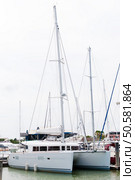 Catamaran docking at the harbour in Phuket, Thailand. Стоковое фото, агентство Ingram Publishing / Фотобанк Лори