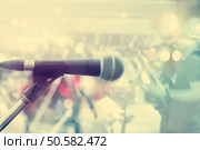 Microphone with guitarist on stage, pastel color and soft concept. Стоковое фото, агентство Ingram Publishing / Фотобанк Лори