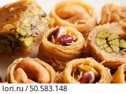 Oriental sweets in shape of nest with nuts close-up macro shot. Oriental sweets in shape of nest with nuts close-up. Стоковое фото, агентство Ingram Publishing / Фотобанк Лори