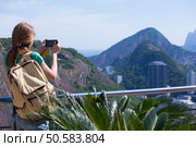 girl tourist  looks at Rio landscape from the Pao do Asucar viewpoint. Стоковое фото, агентство Ingram Publishing / Фотобанк Лори