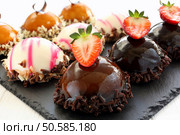 Tray with delicious catering cakes. Стоковое фото, агентство Ingram Publishing / Фотобанк Лори