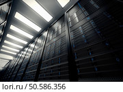 Image presents a bottom view of a room equipped with data servers. Blue LED lights are flashing. Image can represent cloud computing, information storage, etc. or can be the perfect technology background. . Стоковое фото, агентство Ingram Publishing / Фотобанк Лори