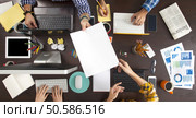 Group of Business People Working on an Office Desk. Стоковое фото, агентство Ingram Publishing / Фотобанк Лори