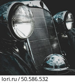 Old retro or vintage car or automobile front side with front lights or headlights and radiator grill. Processed by vintage or retro effect filter. Old retro or vintage car front side. Vintage effect processing. Стоковое фото, агентство Ingram Publishing / Фотобанк Лори