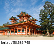 Landscape view of orange coloured Heian Jingu shinto shrine in Kyoto, Japan. The Heian Jingu hosts the Jidai Matsuri, one of the three most important festivals of Kyoto. The procession of this festival begins at the old Imperial palace, and includes carrying the mikoshi (portable shrines) to the Heian Jingu. Стоковое фото, агентство Ingram Publishing / Фотобанк Лори