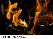 fire flames with sparks on a black background. Стоковое фото, агентство Ingram Publishing / Фотобанк Лори