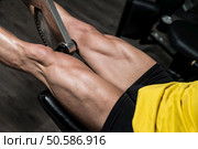 Man Doing Leg Exercises With Machine. Стоковое фото, агентство Ingram Publishing / Фотобанк Лори