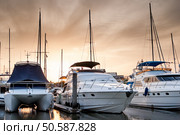 The white sails of yachts on the background of sea and sky in the clouds. Стоковое фото, агентство Ingram Publishing / Фотобанк Лори