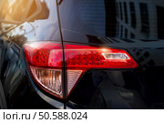 Back light of city car on the street background . Стоковое фото, агентство Ingram Publishing / Фотобанк Лори