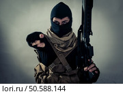 Terrorist menacing western countries on a tape. Concept about terrorism and hybrid warfare. Стоковое фото, агентство Ingram Publishing / Фотобанк Лори
