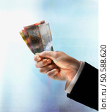 Businessman’s hand holding Swiss Francs. 24316752. Стоковое фото, агентство Ingram Publishing / Фотобанк Лори