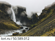 icelandic landscape with Haifoss waterfall on misty day. Стоковое фото, агентство Ingram Publishing / Фотобанк Лори