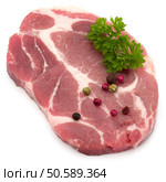 Raw pork neck chop meat with parsley herb leaves and peppercorn spices garnish isolated on white background cutout. Стоковое фото, агентство Ingram Publishing / Фотобанк Лори