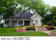 Extremely colorful classic restored house in rural city. Стоковое фото, агентство Ingram Publishing / Фотобанк Лори