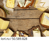 Various types of cheese on rustic background, with copy space. Стоковое фото, агентство Ingram Publishing / Фотобанк Лори