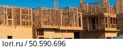 Wooden framing for construction of new condominiums, apartments or townhomes. Стоковое фото, агентство Ingram Publishing / Фотобанк Лори