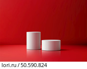 Minimalist 3D scene featuring white cylindrical empty platforms against a vibrant red backdrop, product mockups, showroom displays, and professional presentation designs. Стоковая иллюстрация, агентство Ingram Publishing / Фотобанк Лори