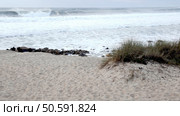 Furadouro Beach, Portugal, where strong Atlantic waves challenge coastal stability, leading to ongoing erosion concerns. Стоковое фото, агентство Ingram Publishing / Фотобанк Лори