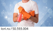 Glittered blue background with male housekeeper and cleaning equipment. Стоковое фото, агентство Ingram Publishing / Фотобанк Лори