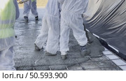 Construction workers pour concrete from a concrete pump. Стоковое видео, видеограф Igor Skripachev / Фотобанк Лори