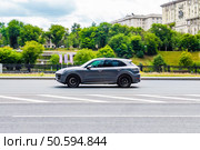 Porsche Cayenne GTS rides on city road, side view. Редакционное фото, фотограф Константин Григорьев / Фотобанк Лори