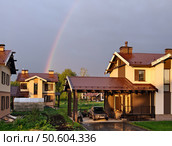 Rainbow over the cottage village after summer rain. Редакционное фото, фотограф Сергей Пристяжнюк (Serg Zastavkin) / Фотобанк Лори