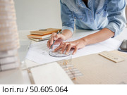 Architecture drawing on architectural project business architecture building construction Colleagues interior designer Corporate Planning Design on blueprint Teamwork with compasses. Стоковое фото, агентство Ingram Publishing / Фотобанк Лори